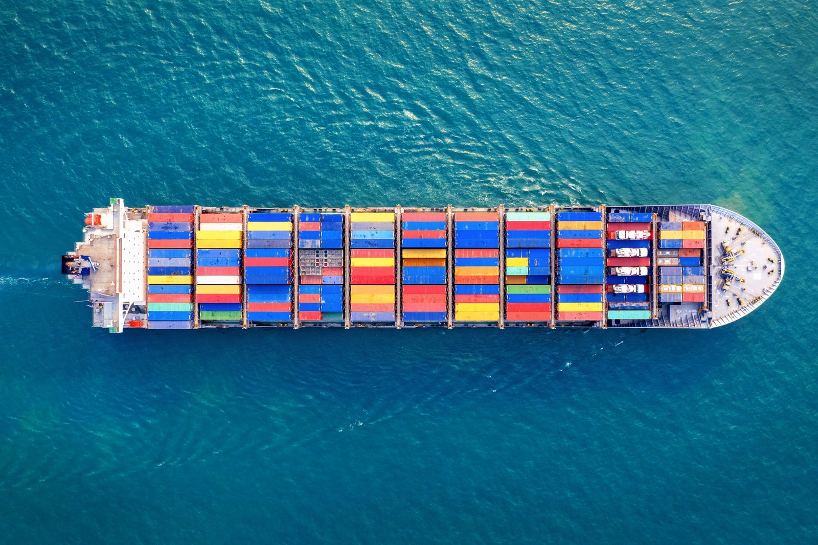 Top view of a container vessel at sea representing Al Aziz Industries export capability